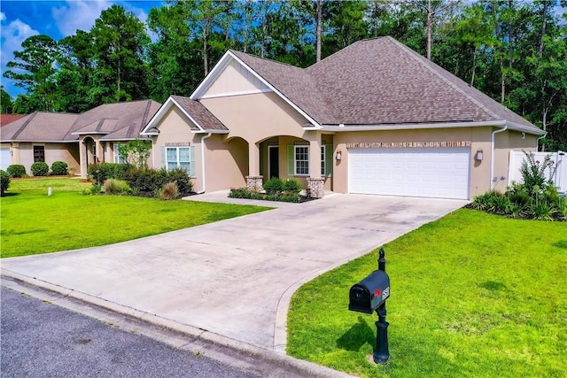 550 Freedom Trl, Brunswick, GA 31525 - view of front facade with a garage and a front yard