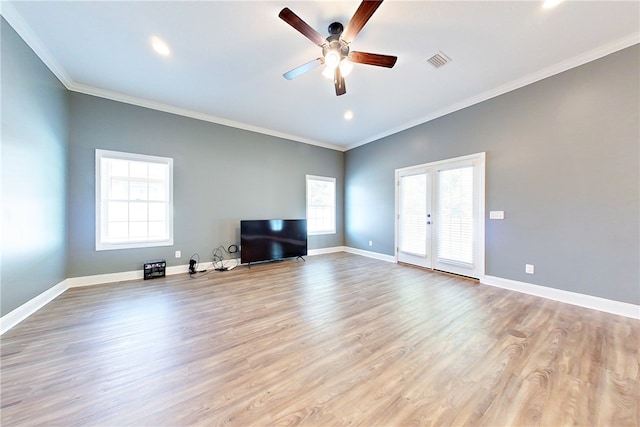550 Freedom Trl, Brunswick, GA 31525 - unfurnished living room with french doors, light hardwood / wood-style floors, ceiling fan, and ornamental molding