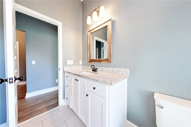 550 Freedom Trl, Brunswick, GA 31525 - bathroom featuring hardwood / wood-style floors, vanity, and toilet