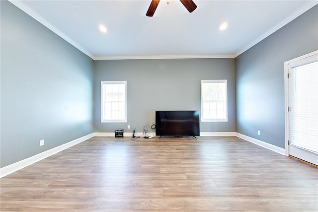 550 Freedom Trl, Brunswick, GA 31525 - unfurnished living room with a wealth of natural light, light hardwood / wood-style floors, and ornamental molding