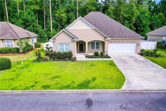 550 Freedom Trl, Brunswick, GA 31525 - view of front of home featuring a front lawn and a garage