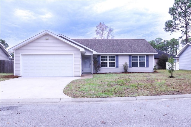 ranch-style home featuring a garage and a front lawn