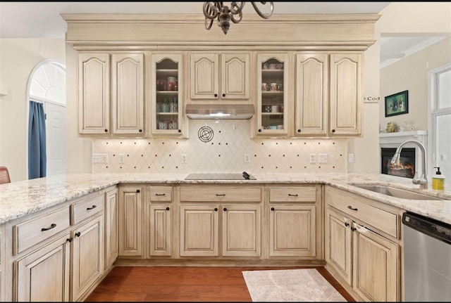 704 Dungeness, Saint Simons Island, GA 31522 - kitchen featuring dishwasher, light wood-style floors, a peninsula, decorative backsplash, and crown molding