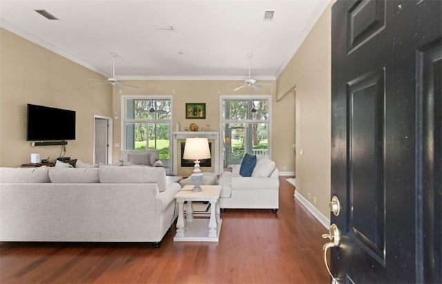 704 Dungeness, Saint Simons Island, GA 31522 - living room with ceiling fan, dark wood-type flooring, and ornamental molding