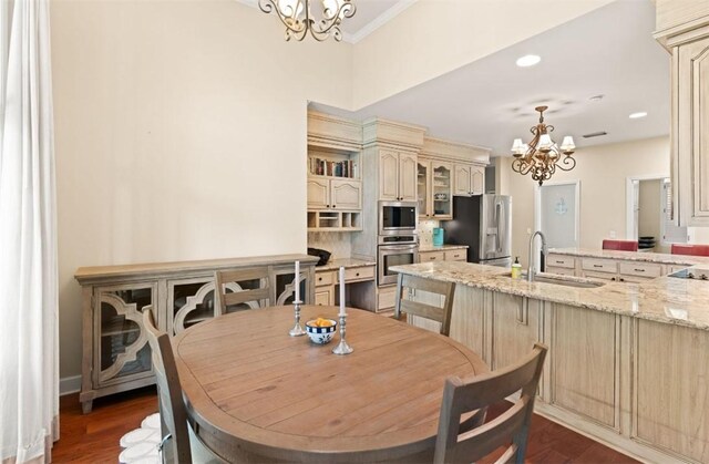 704 Dungeness, Saint Simons Island, GA 31522 - dining area featuring a chandelier, dark wood finished floors, recessed lighting, and ornamental molding