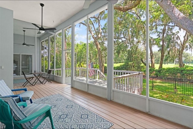 704 Dungeness, Saint Simons Island, GA 31522 - sunroom with ceiling fan and view of scattered trees