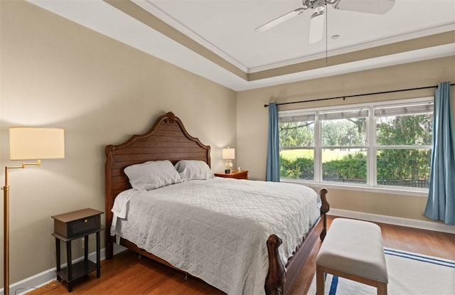 704 Dungeness, Saint Simons Island, GA 31522 - bedroom featuring wood finished floors, ornamental molding, and ceiling fan