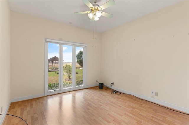 unfurnished room with ceiling fan and light wood-type flooring