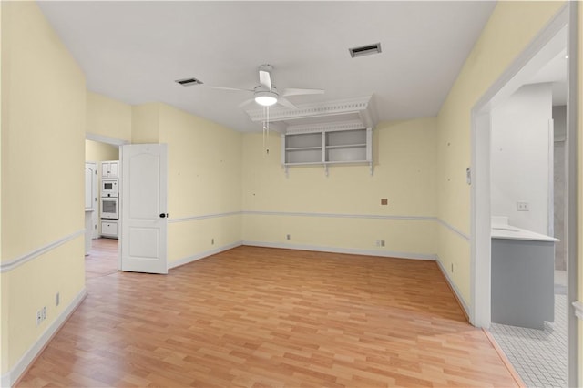 unfurnished room with light hardwood / wood-style floors and ceiling fan