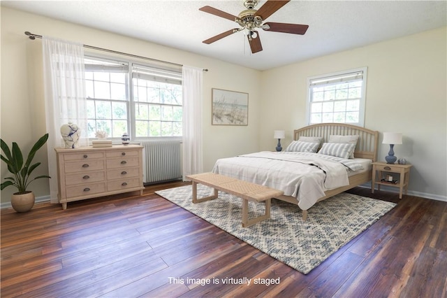 140 Belle Point Pkwy, Brunswick, GA 31525 - bedroom with radiator heating unit, dark wood-style floors, and ceiling fan
