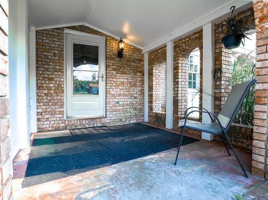 140 Belle Point Pkwy, Brunswick, GA 31525 - entrance to property with brick siding and covered porch