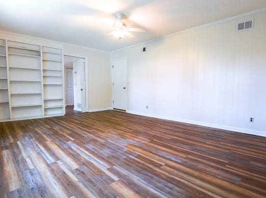 140 Belle Point Pkwy, Brunswick, GA 31525 - unfurnished bedroom featuring dark wood-type flooring, crown molding, and ceiling fan