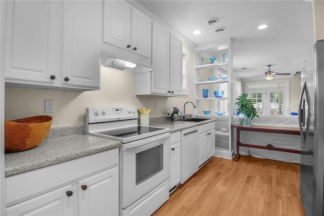 800 Wayne St, Darien, GA 31305 - kitchen featuring white electric stove, a sink, dishwashing machine, freestanding refrigerator, and under cabinet range hood