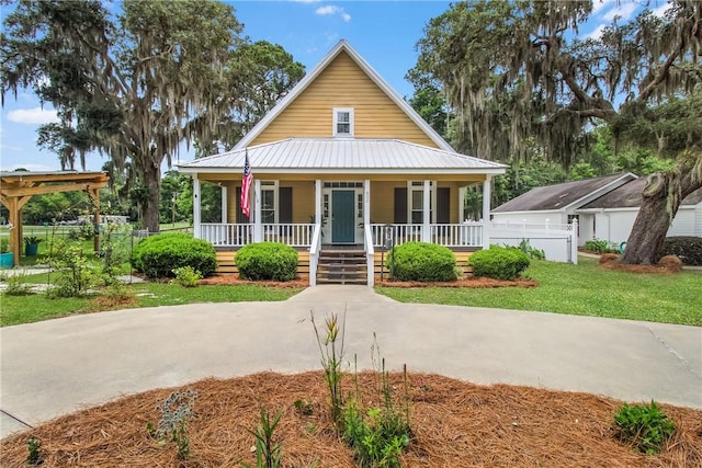 800 Wayne St, Darien, GA 31305 - view of front of home with covered porch and metal roof