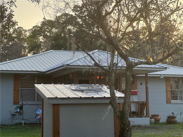 view of property exterior at dusk