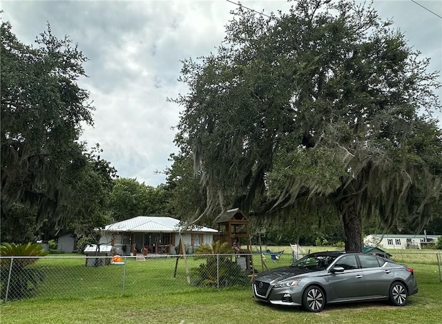 view of property's community with a lawn