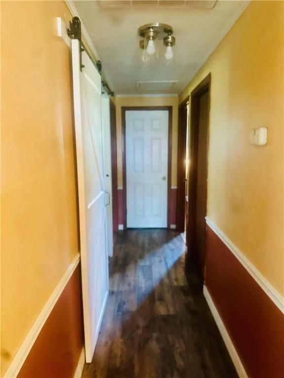 hall featuring dark hardwood / wood-style flooring and a barn door