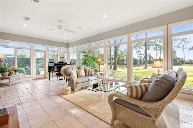 sunroom with ceiling fan and a healthy amount of sunlight