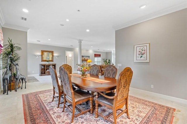 dining area with decorative columns, crown molding, and light tile patterned floors