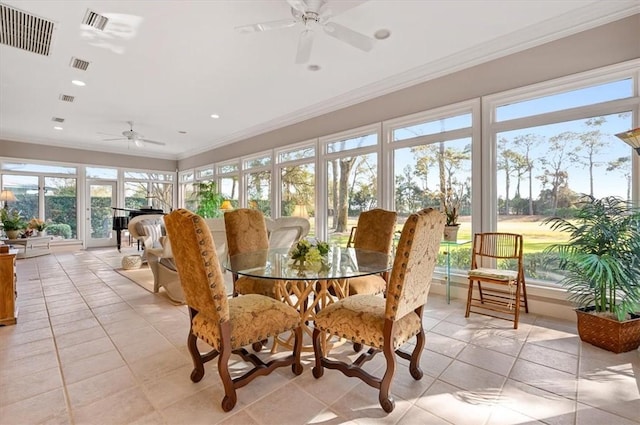 sunroom / solarium featuring ceiling fan