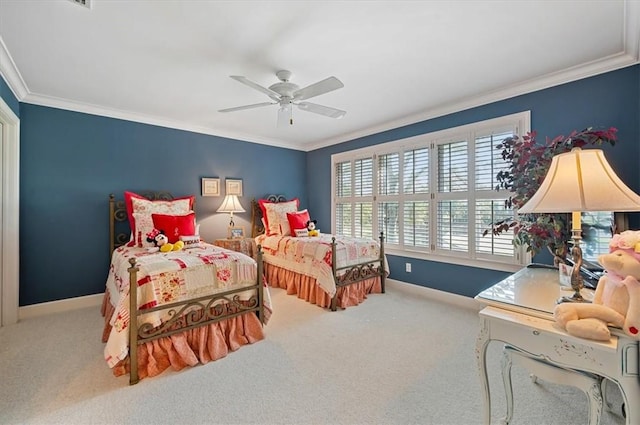 carpeted bedroom featuring ceiling fan and ornamental molding