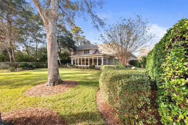 view of yard with a sunroom