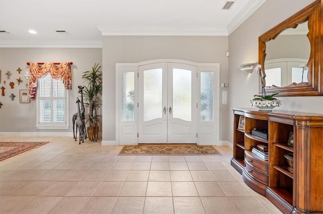 entryway featuring french doors and ornamental molding