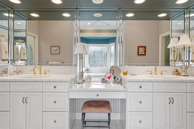 bathroom with tile patterned floors, backsplash, and vanity