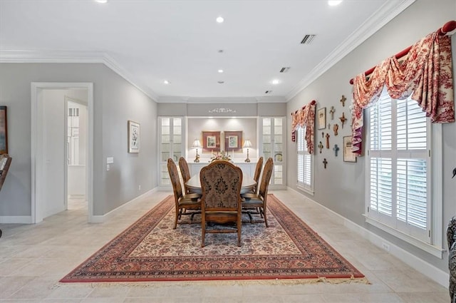 dining space with a healthy amount of sunlight, light tile patterned flooring, crown molding, and french doors