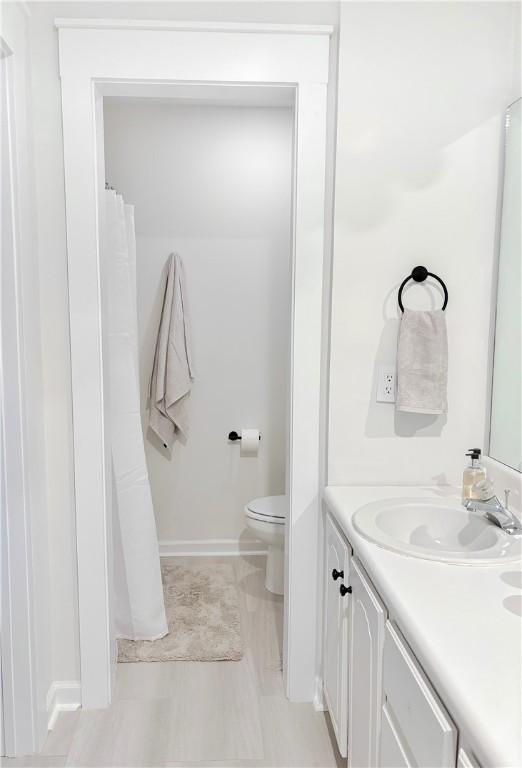 bathroom with vanity and toilet