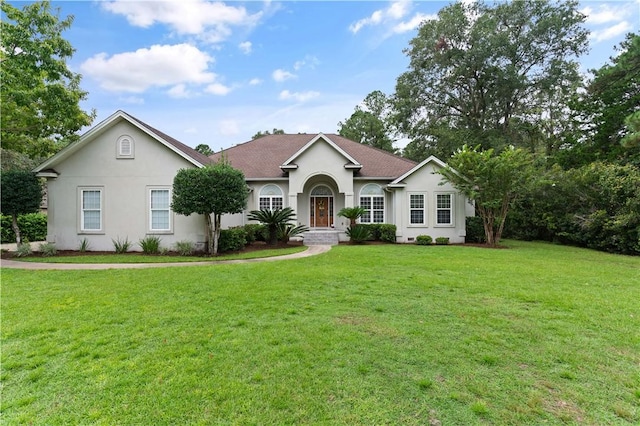 single story home featuring a front yard