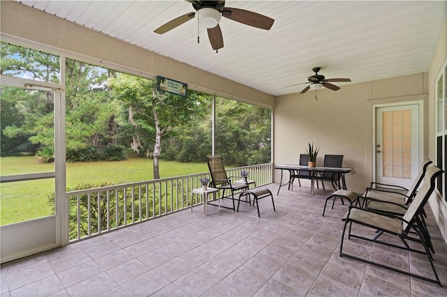 sunroom / solarium with ceiling fan