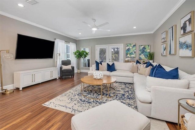living room featuring a ceiling fan, recessed lighting, crown molding, and wood finished floors