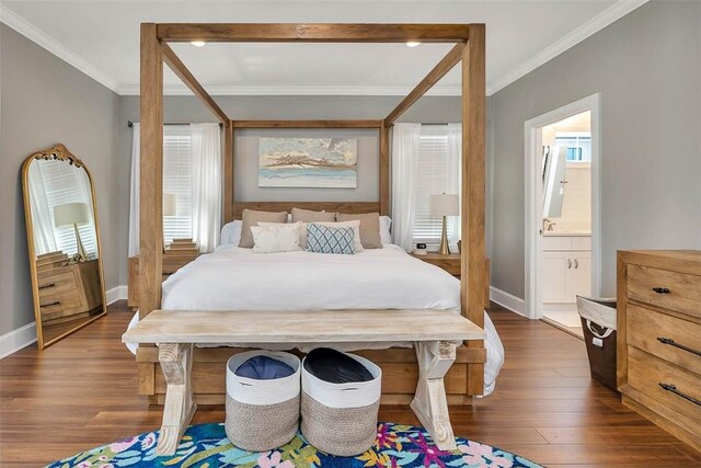 bedroom with baseboards, crown molding, multiple windows, and dark wood-type flooring