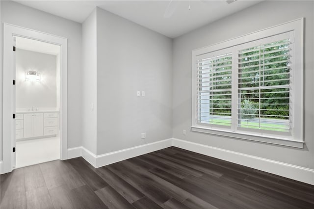 spare room featuring dark hardwood / wood-style flooring