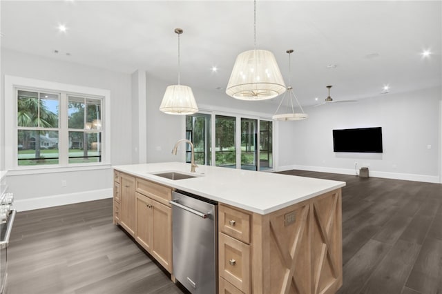 kitchen featuring dark hardwood / wood-style flooring, stainless steel dishwasher, ceiling fan, a kitchen island with sink, and sink