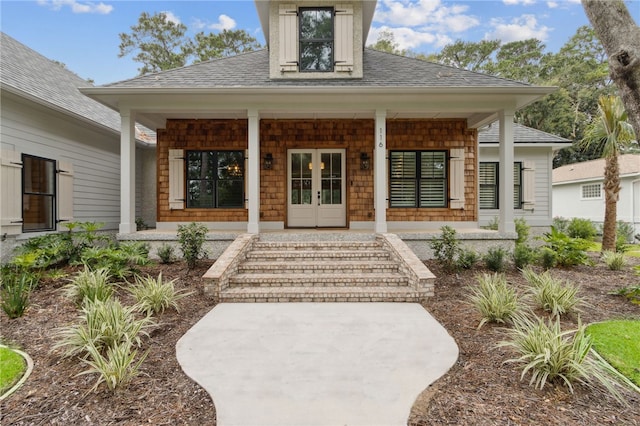 view of exterior entry featuring a porch