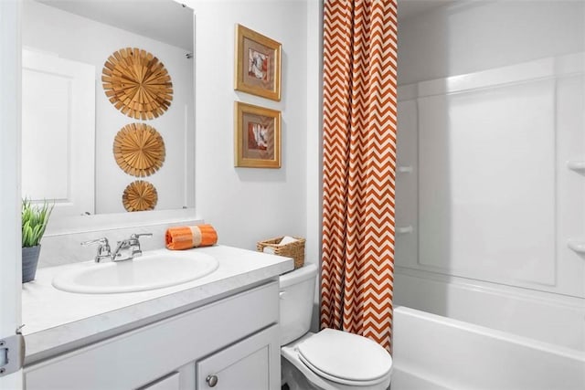 full bathroom with vanity, toilet, and shower / tub combo with curtain