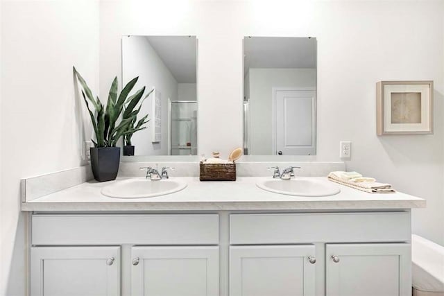 bathroom with vanity and an enclosed shower