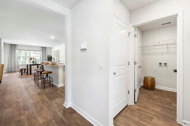 hallway with dark hardwood / wood-style floors