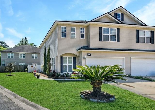 view of front of home with a garage and a front lawn