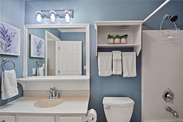 bathroom with vanity, tub / shower combination, and toilet
