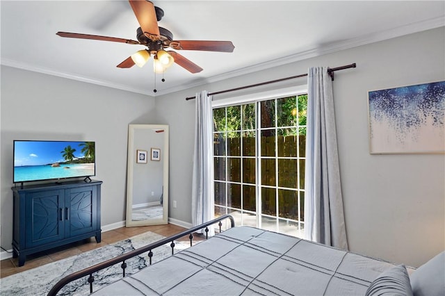 bedroom with tile patterned flooring, crown molding, baseboards, and a ceiling fan