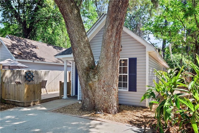 exterior space with fence and a deck
