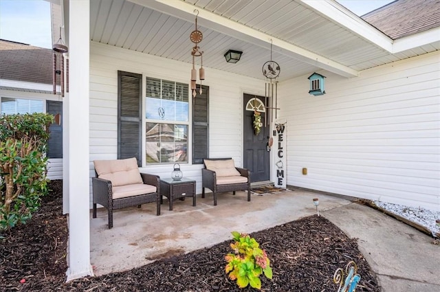 view of exterior entry with covered porch