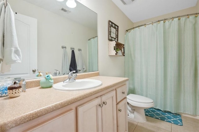 bathroom featuring tile patterned flooring, vanity, and toilet