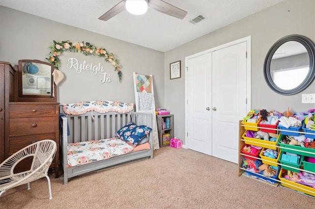 bedroom with carpet flooring, a closet, and ceiling fan