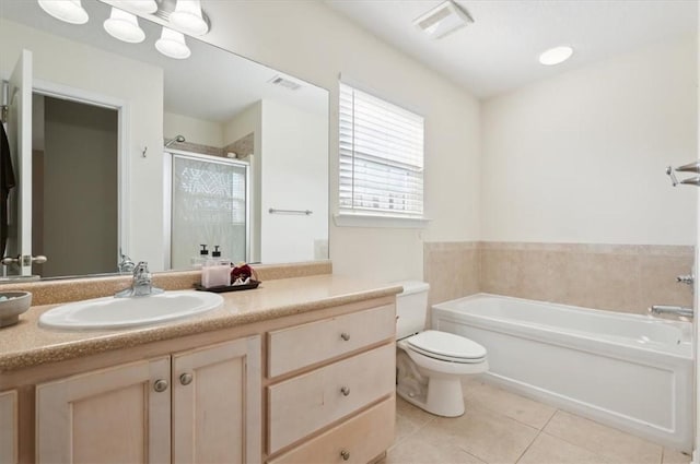 full bathroom featuring tile patterned flooring, vanity, toilet, and plus walk in shower