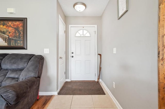 foyer entrance with tile patterned floors