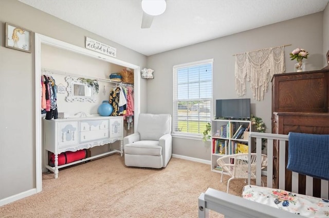 carpeted bedroom with a closet and ceiling fan